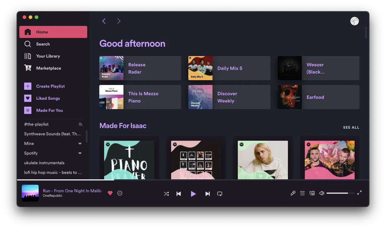 Spotify with Sleek Elementary theme — a minimal dark interface with warm orange accents